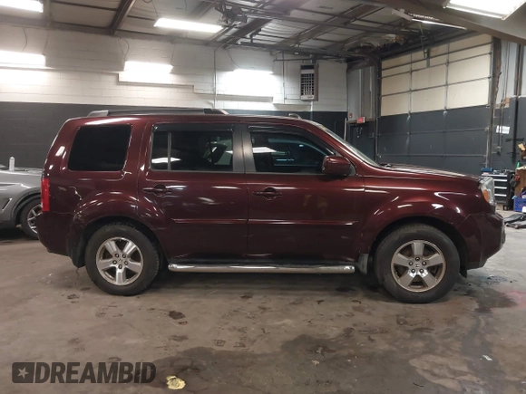 2009 Honda Pilot EX-L with VIN 5FNYF48569B021586, listed as a IAAI auction lot 41609721 with 291,598 mi miles. Bid and sale history available at carsss.com. Image 13.