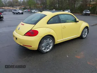 2012 Volkswagen Beetle 2.5L w/Sound/Nav PZEV with VIN 3VWJP7AT4CM613867, listed as a IAAI auction lot 41602806 with 167,004 mi miles. Bid and sale history available at carsss.com. Image 4.