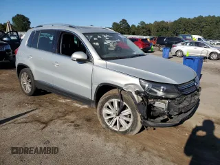2014 Volkswagen Tiguan SE with VIN WVGAV3AX9EW611860, listed as a Copart auction lot 74431754 with 116,022 mi miles and Salvage title. Bid and sale history available at DreamBid. Image 4.