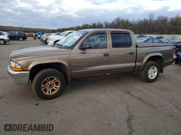 2001 Dodge Dakota z VIN 1B7GG2AX11S108005, wystawiony jako Copart lot #87124934 z przebiegiem 248 482 mil mil oraz Czysty tytuł • Clean title. Historia ofert i sprzedaży dostępna na DreamBid. Obrazek 1.
