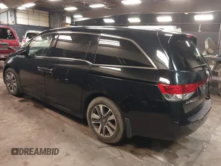 2014 Honda Odyssey Touring with VIN 5FNRL5H94EB105745, listed as a IAAI auction lot 41744012 with 77,032 mi miles and . Bid and sale history available at DreamBid. Image 3.