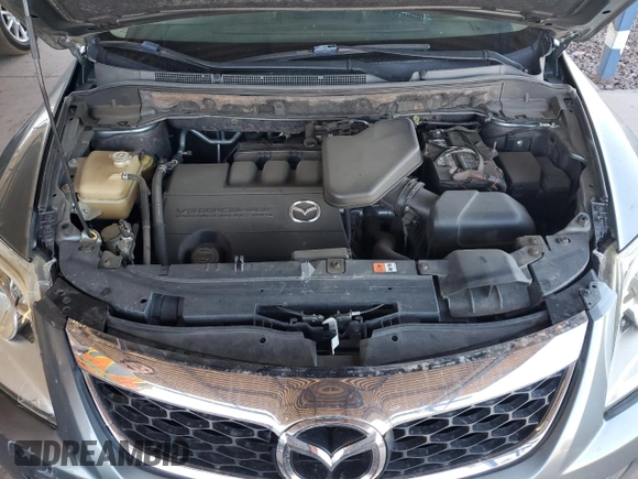 2012 Mazda CX-9 Grand Touring z VIN JM3TB2DA6C0348788, wystawiony jako Copart lot #52444915 z przebiegiem 130 392 mil mil oraz Szkoda całkowita • Salvage title. Historia ofert i sprzedaży dostępna na DreamBid. Obrazek 12.