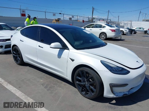 2019 Tesla Model 3 Mid Range with VIN 5YJ3E1EA5KF327181, listed as a IAAI auction lot 41860943 with 157,335 mi miles and . Bid and sale history available at DreamBid. Image 1.