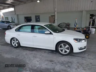 2015 Volkswagen Passat 1.8T Limited Edition with VIN 1VWAT7A3XFC100852, listed as a IAAI auction lot 41204902 with 85,725 mi miles. Bid and sale history available at carsss.com. Image 13.