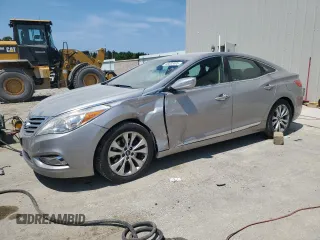 2012 Hyundai Azera z VIN KMHFG4JG8CA125699, wystawiony jako Copart lot #66603405 z przebiegiem 129 673 mil mil oraz Czysty tytuł • Clean title. Historia ofert i sprzedaży dostępna na DreamBid. Obrazek 1.