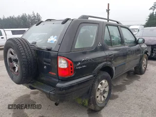 2000 Isuzu Rodeo z VIN 4S2DM58W5Y4327854, wystawiony jako IAAI lot #41288281 z przebiegiem 190 115 mil mil oraz . Historia ofert i sprzedaży dostępna na DreamBid. Obrazek 4.