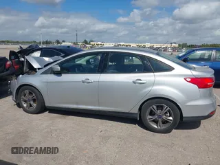 2018 Ford Focus SE z VIN 1FADP3FE3JL220529, wystawiony jako IAAI lot #41564216 z przebiegiem 16 883 mil mil oraz . Historia ofert i sprzedaży dostępna na DreamBid. Obrazek 14.
