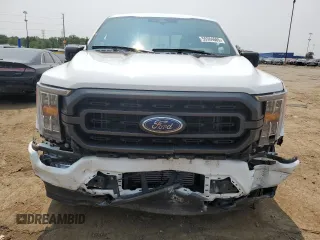 2023 Ford F-150 XL with VIN 1FTEW1EP7PFB66555, listed as a Copart auction lot 59384665 with 28,495 mi miles and Salvage title. Bid and sale history available at DreamBid. Image 5.