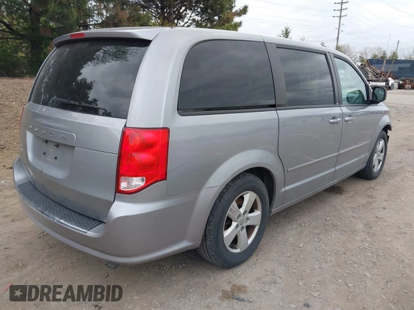 2014 Dodge Grand Caravan American Value with VIN 2C4RDGBG0ER168085, listed as a IAAI auction lot 42020959 with 213,383 mi miles and . Bid and sale history available at DreamBid. Image 4.