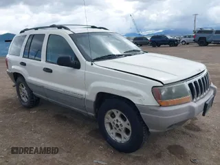 2000 Jeep Grand Cherokee Laredo z VIN 1J4GW48N7YC351920, wystawiony jako IAAI lot #41931545 z przebiegiem 321 963 mil mil oraz . Historia ofert i sprzedaży dostępna na DreamBid. Obrazek 1.