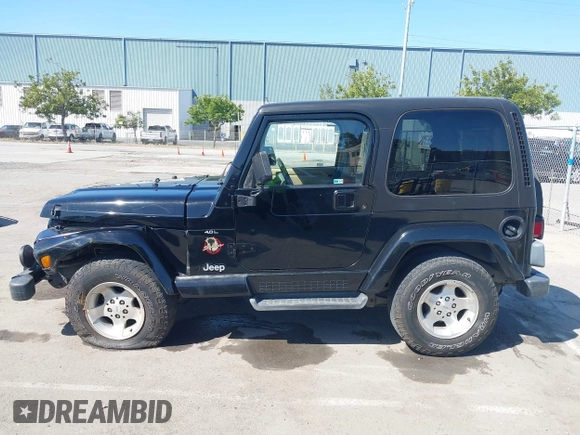 2001 Jeep Wrangler Sahara z VIN 1J4FA59S41P313113, wystawiony jako IAAI lot #42266173 z przebiegiem 125 792 mil mil oraz . Historia ofert i sprzedaży dostępna na DreamBid. Obrazek 14.