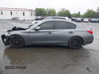 2015 Infiniti Q50 Premium with VIN JN1BV7APXFM358127, listed as a IAAI auction lot 42364173 with 97,512 mi miles and . Bid and sale history available at DreamBid. Image 14.