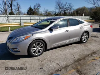 2013 Hyundai Azera z VIN KMHFG4JG8DA256908, wystawiony jako Copart lot #50573915 z przebiegiem 146 015 mil mil oraz Szkoda całkowita • Salvage title. Historia ofert i sprzedaży dostępna na DreamBid. Obrazek 1.