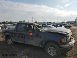 2001 Ford F-150 SuperCrew XLT with VIN 1FTRW08L41KE26431, listed as a Copart auction lot 70040784 with 0 mi miles and Salvage Title. Bid and sale history available at carsss.com. Image 4.