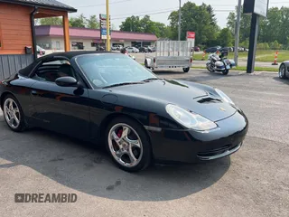1999 Porsche 911 z VIN WP0CA2990XS651134, wystawiony jako Copart lot #59694365 z przebiegiem 80 805 mil mil oraz Czysty tytuł • Clean title. Historia ofert i sprzedaży dostępna na DreamBid. Obrazek 1.