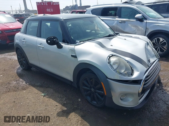 2016 MINI Hardtop 4 Door z VIN WMWXU1C54G2A93779, wystawiony jako IAAI lot #41933339 z przebiegiem 85 000 mil mil oraz . Historia ofert i sprzedaży dostępna na DreamBid. Obrazek 1.