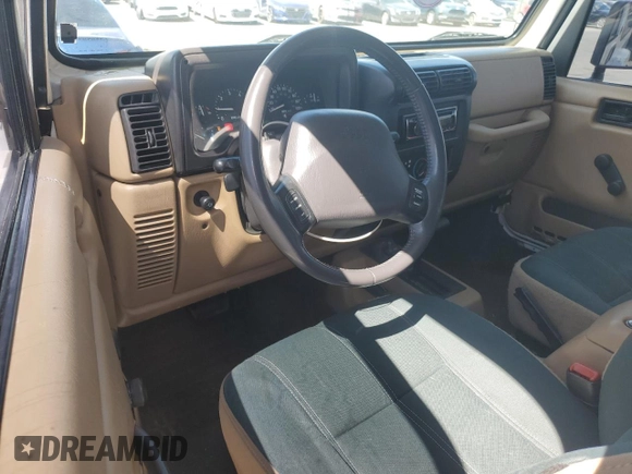 2000 Jeep Wrangler Sahara with VIN 1J4FA59S6YP790541, listed as a Copart auction lot 53837885 with 137,827 mi miles and Salvage title. Bid and sale history available at DreamBid. Image 8.