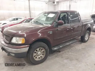 2001 Ford F-150 XLT with VIN 1FTRW08L51KE26356, listed as a IAAI auction lot 41011838 with Not provided miles and . Bid and sale history available at DreamBid. Image 2.
