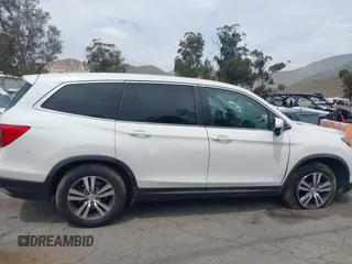 2016 Honda Pilot EX-L with VIN 5FNYF5H55GB015166, listed as a IAAI auction lot 42003009 with 142,488 mi miles and . Bid and sale history available at DreamBid. Image 12.