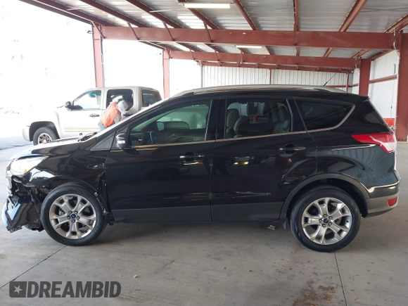 2015 Ford Escape Titanium with VIN 1FMCU0J98FUB95597, listed as a IAAI auction lot 41785188 with 84,141 mi miles. Bid and sale history available at carsss.com. Image 13.