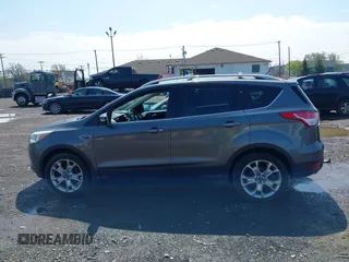2014 Ford Escape Titanium with VIN 1FMCU9J99EUA75276, listed as a IAAI auction lot 42148537 with 163,330 mi miles and . Bid and sale history available at DreamBid. Image 14.
