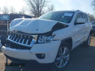 2012 Jeep Grand Cherokee Laredo with VIN 1C4RJFAG5CC310893, listed as a IAAI auction lot 41695279 with 136,821 mi miles. Bid and sale history available at carsss.com. Image 17.