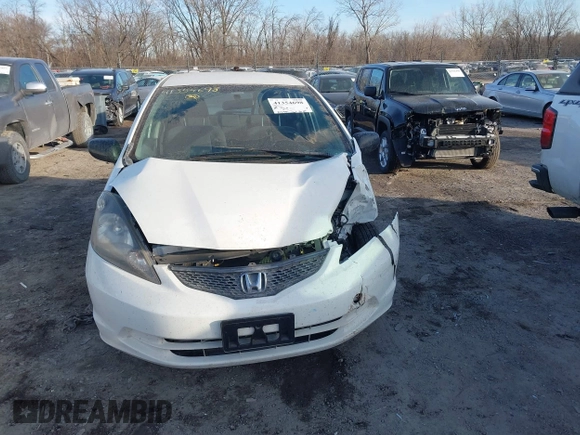 2009 Honda Fit z VIN JHMGE88249S067463, wystawiony jako IAAI lot #41354698 z przebiegiem 153 402 mil mil oraz . Historia ofert i sprzedaży dostępna na DreamBid. Obrazek 12.