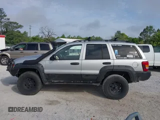 2003 Jeep Grand Cherokee Laredo z VIN 1J8GW48S33C519680, wystawiony jako IAAI lot #42126714 z przebiegiem 295 517 mil mil oraz . Historia ofert i sprzedaży dostępna na DreamBid. Obrazek 14.