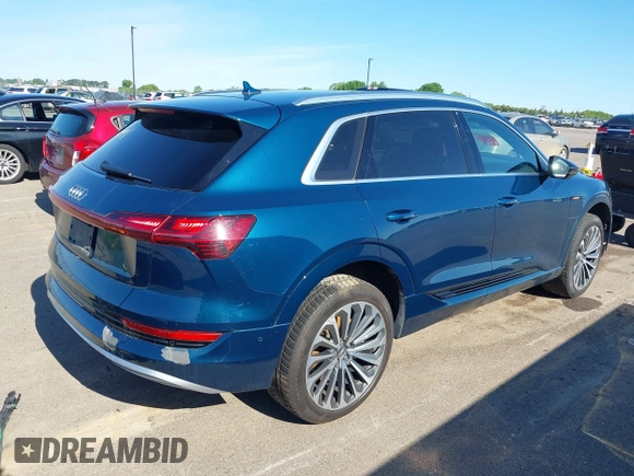 2019 Audi e-tron Prestige with VIN WA1VABGE0KB009718, listed as a IAAI auction lot 42336983 with 54,871 mi miles and . Bid and sale history available at DreamBid. Image 4.