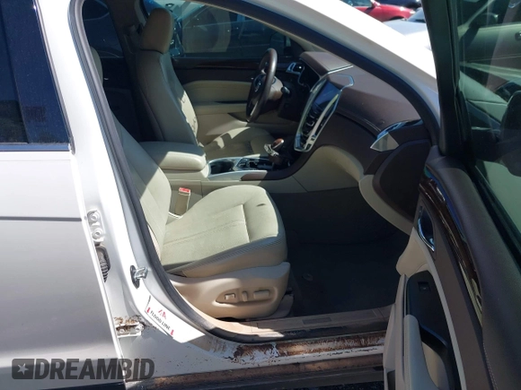 2013 Cadillac SRX Premium Collection with VIN 3GYFNEE33DS554556, listed as a IAAI auction lot 42152972 with 144,668 mi miles and . Bid and sale history available at DreamBid. Image 5.