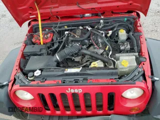2008 Jeep Wrangler X z VIN 1J4FA24188L650933, wystawiony jako Copart lot #60603225 z przebiegiem 121 682 mil mil oraz Szkoda całkowita • Salvage title. Historia ofert i sprzedaży dostępna na DreamBid. Obrazek 11.