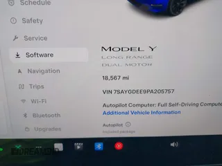 2023 Tesla Model Y Long Range with VIN 7SAYGDEE9PA205757, listed as a IAAI auction lot 41705881 with 18,567 mi miles and . Bid and sale history available at carsss.com. Image 15.