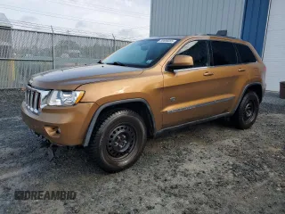 2011 Jeep Grand Cherokee Laredo z VIN 1J4RR4GGXBC697695, wystawiony jako Copart lot #59696055 z przebiegiem 148 537 mil mil oraz Szkoda całkowita • Salvage title. Historia ofert i sprzedaży dostępna na DreamBid. Obrazek 1.