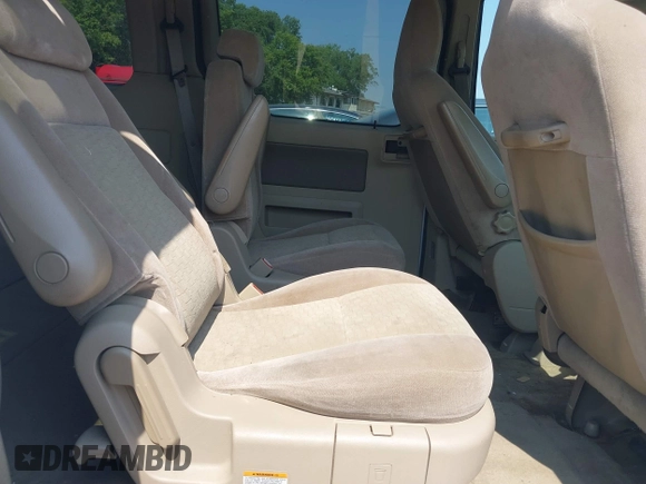 2006 Ford Freestar SE z VIN 2FMDA51666BA57711, wystawiony jako IAAI lot #39989040 z przebiegiem Nie podano mil oraz . Historia ofert i sprzedaży dostępna na DreamBid. Obrazek 8.
