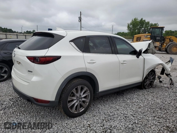 2019 Mazda CX-5 Grand Touring with VIN JM3KFADM6K1581261, listed as a Copart auction lot 59965175 with 127,837 mi miles and Salvage title. Bid and sale history available at DreamBid. Image 3.