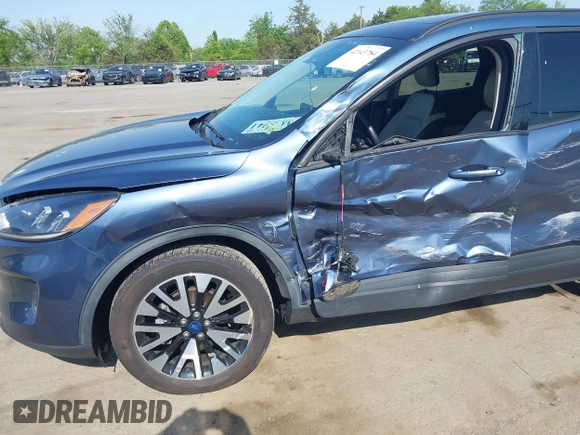 2020 Ford Escape SE Sport Hybrid with VIN 1FMCU9BZ6LUC38008, listed as a IAAI auction lot 42143784 with 81,804 mi miles and . Bid and sale history available at DreamBid. Image 6.