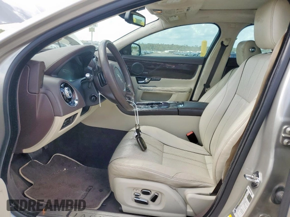 2013 Jaguar XJ Portfolio with VIN SAJWJ2GD5D8V49505, listed as a Copart auction lot 61171955 with 129,158 mi miles and Salvage title. Bid and sale history available at DreamBid. Image 7.