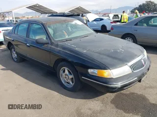 1997 Lincoln Continental with VIN 1LNLM97V5VY665410, listed as a IAAI auction lot 41239128 with 66,873 mi miles. Bid and sale history available at carsss.com. Image 1.