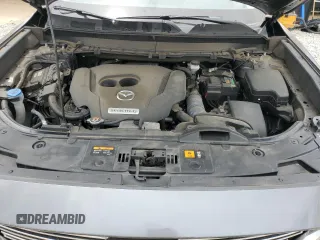 2020 Mazda CX-9 Touring z VIN JM3TCACY3L0411822, wystawiony jako Copart lot #60323295 z przebiegiem 61 348 mil mil oraz Szkoda całkowita • Salvage title. Historia ofert i sprzedaży dostępna na DreamBid. Obrazek 12.