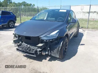 2021 Tesla Model Y Long Range with VIN 5YJYGDEE4MF076791, listed as a IAAI auction lot 41945750 with Not Provided miles and . Bid and sale history available at DreamBid. Image 2.