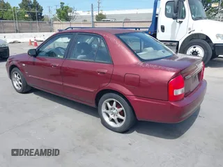 2002 Mazda Protege DX with VIN JM1BJ225621608984, listed as a IAAI auction lot 42106167 with 158,662 mi miles and . Bid and sale history available at DreamBid. Image 3.