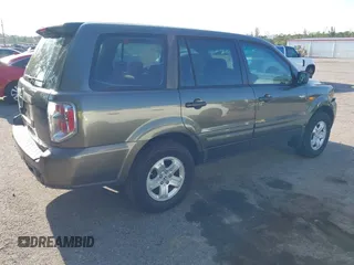 2006 Honda Pilot LX with VIN 5FNYF28156B040336, listed as a IAAI auction lot 42223190 with 158,686 mi miles and . Bid and sale history available at DreamBid. Image 4.
