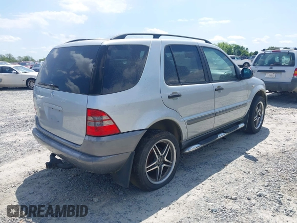 1998 Mercedes-Benz M-Class with VIN 4JGAB54E3WA031579, listed as a IAAI auction lot 42004335 with 156,898 mi miles. Bid and sale history available at carsss.com. Image 4.