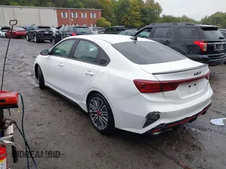 2022 Kia Forte GT with VIN 3KPF44AC9NE460058, listed as a IAAI auction lot 40385898 with 57,961 mi miles. Bid and sale history available at carsss.com. Image 3.