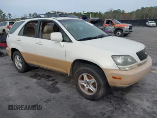 1999 Lexus RX 300 Luxury SUV with VIN JT6GF10U5X0038086, listed as a IAAI auction lot 41571366 with 214,094 mi miles. Bid and sale history available at carsss.com. Image 1.