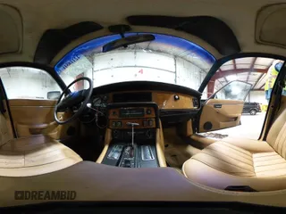 1985 Jaguar XJ with VIN SAJAV1347FC414864, listed as a IAAI auction lot 42118511 with 117,185 mi miles and . Bid and sale history available at DreamBid. Image 18.