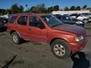 2001 Isuzu Rodeo S with VIN 4S2CK58W014302125, listed as a Copart auction lot 76425614 with 204,350 mi miles and Salvage title. Bid and sale history available at DreamBid. Image 4.