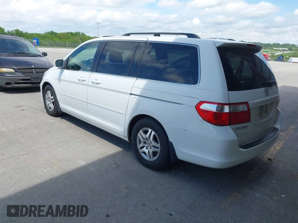 2007 Honda Odyssey EX-L with VIN 5FNRL38787B144585, listed as a IAAI auction lot 42139957 with 211,412 mi miles and . Bid and sale history available at DreamBid. Image 3.
