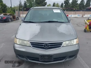 2002 Honda Odyssey EX-L z VIN 2HKRL18922H542116, wystawiony jako IAAI lot #42130335 z przebiegiem 205 053 mil mil oraz . Historia ofert i sprzedaży dostępna na DreamBid. Obrazek 6.