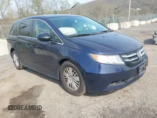 2014 Honda Odyssey LX z VIN 5FNRL5H29EB090470, wystawiony jako IAAI lot #42091740 z przebiegiem 176 861 mil mil oraz . Historia ofert i sprzedaży dostępna na DreamBid. Obrazek 1.